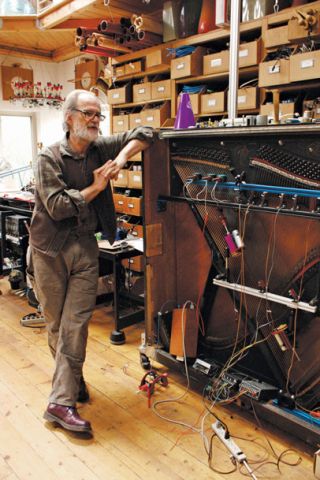 Local sound sculptor Trimpin in his Madrona studio with one of his deconstructed pianos