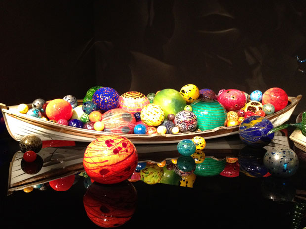 A boat full of glass floats on display at Chihuly Garden and Glass